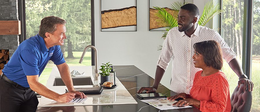 HVAC salesperson discussing products with homeowners