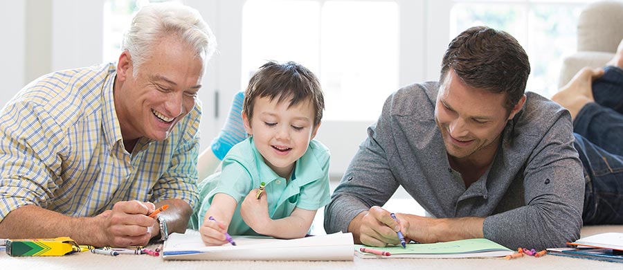 Three generations spending some time doing art projects in a comfortable home